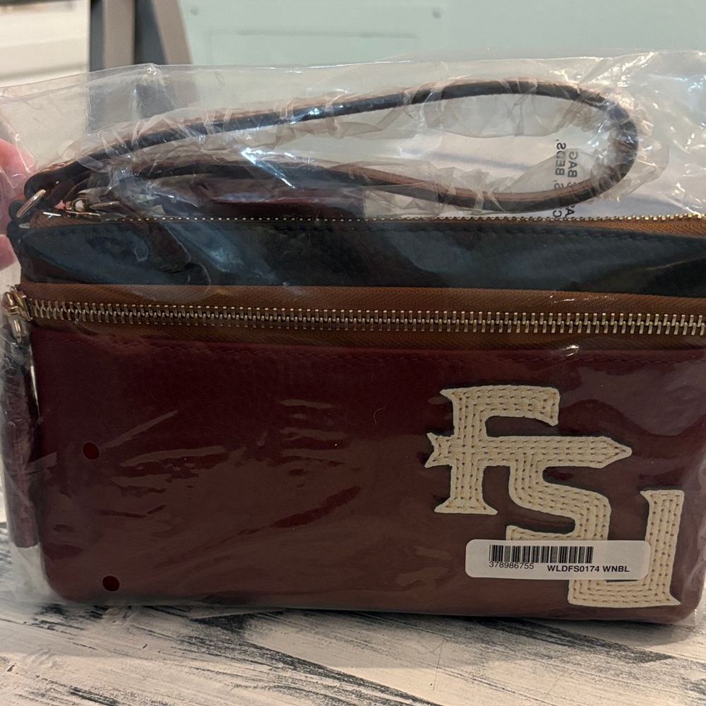 Dooney & Bourke. GARNET & GOLD  infield Double. Zip WRISTLET